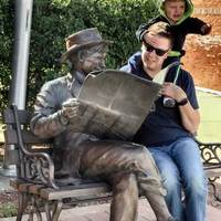 Will Rogers Reads a Newspaper