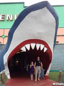 Standing in the shark mouth entrance.