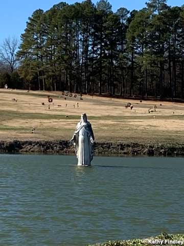 Jesus walks on the pond.
