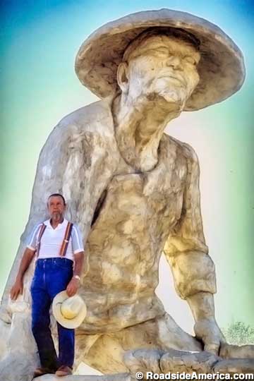 Ken Fox and one of his statues.