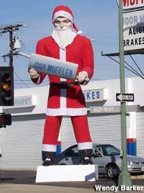 Joor Muffler Man in Santa duds.