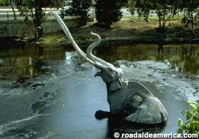 Elephant state trapped in tar pit.
