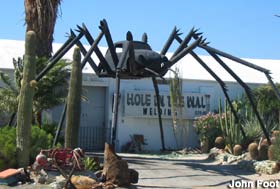 Metal sculpture of VW bug spider.