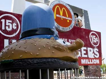 Officer Big Mac guards the truncated 15-cent hamburger sign.