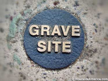 Sidewalk grave site marker.