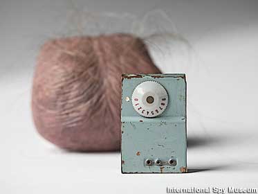 Phony scrotum and its tiny radio transmitter.