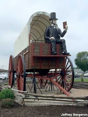 Lincoln on covered wagon.