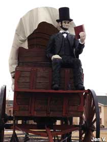 Lincoln reads on the wagon.