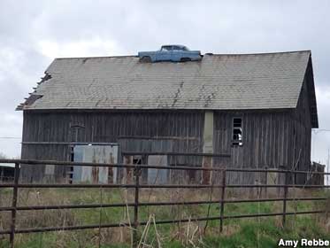 Car on a barn.