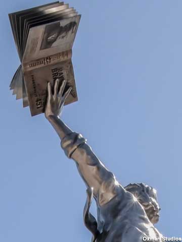 Ray Bradbury sculpture's left hand holds a copy of his book Fahrenheit 451.