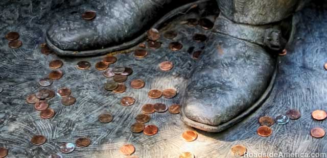 Pennies at the feet of the Frito Lay Magician.
