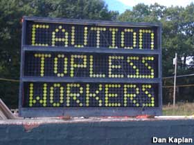 Caution Topless Workers.