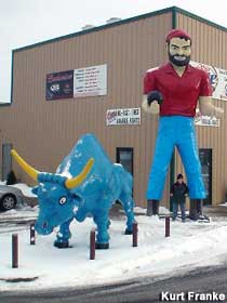 Paul Bunyan and Babe are bowling.