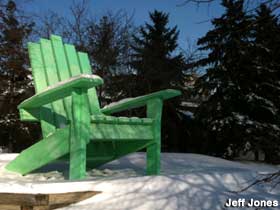 Green chair in winter.