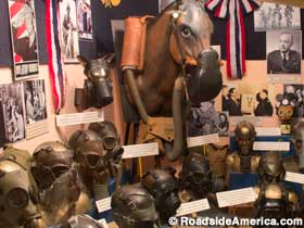 Gas mask display, including the horse, dog and Mickey Mouse masks.