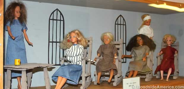 Diorama of a typical 1960s mental hospital ward features a straitjacket Barbie.