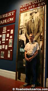 Gary stands for scale in front of the Robert Wadlow display.
