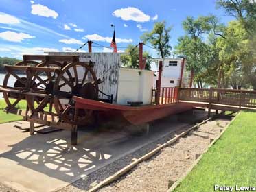 Paddle-wheel Sioux Ferry displayed on land.