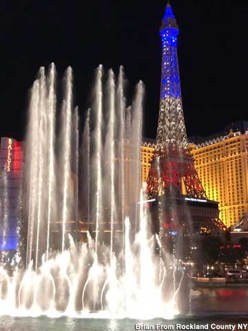 The Bellagio Fountain show, 2022, with the Eiffel Tower in background.