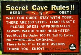 Secret Cave Rules sign.