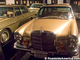 Lucy's 1972 gold Mercedes, multiplied by mirrors.