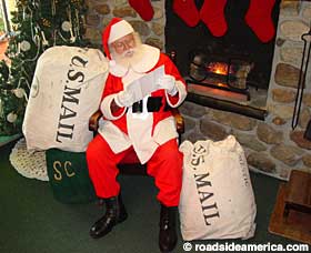 Santa reads mail in North Pole, New York.