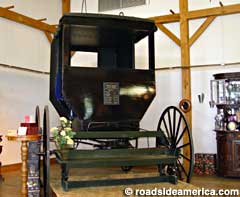 World's Largest Amish Buggy, at Wendell August Forge, Berlin, Ohio. 10 ft. 1.5 in. tall, 13 ft. 9 in. wide, 1,200 lbs.