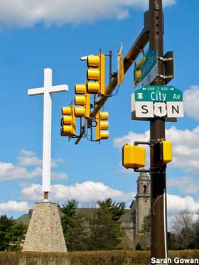 S1n City sign and cross.