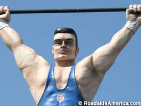 Weightlifter on sign.