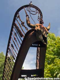 Metal stairs and skull sculpture.