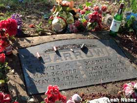 Clyde Barrow grave, augmented with liquor bottles and shotgun shells.