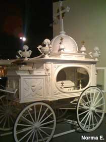 Ornate funeral wagon.