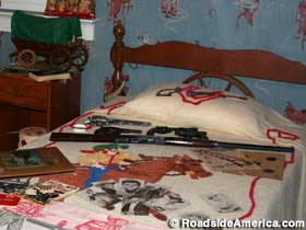 Boy's bedroom with toy guns.