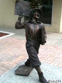 Newsboy statue.