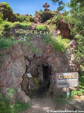 Cave entrance with its cautionary sign.