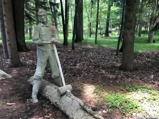 Abe Lincoln splitting a log.