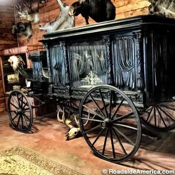 Horse-drawn hearse.