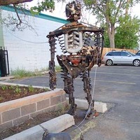 Scrap Metal Robot Walks Dog