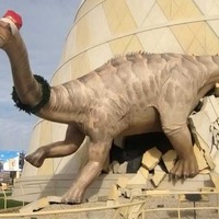 Three Dinosaurs Breaking Out Of Children's Museum
