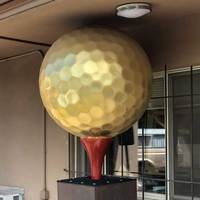 Big Dynamite and Gold Golf Ball