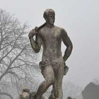 Statue of Man Trampling Mermaids