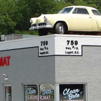 Vintage Car on Top of Laundromat