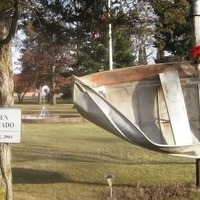 Tornado Boat Wrapped Around Pole