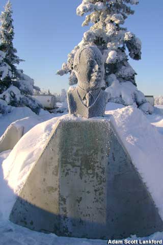 An outdoor bust of Martin Luther King Jr. in a snow-covered landscape.