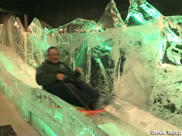 Man rides down slide made of ice at the Ice Museum.