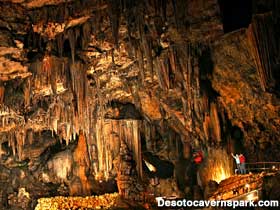 Wall of illuminated flowstone inside DeSoto Caverns.