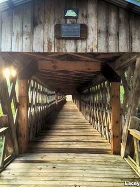 Entrance to wooden covered bridge.