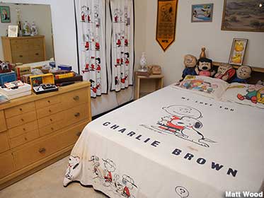 Tim's childhood bedroom has a Peanuts theme. Good grief.