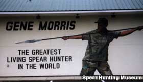 Building sign - Gene Morris, The Greatest Living Spear Hunter in the World.