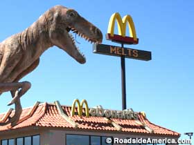 Dinosaur statue at McDonald's.
